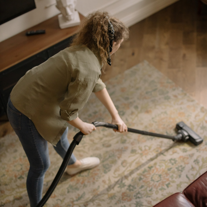 vacuuming a carpet